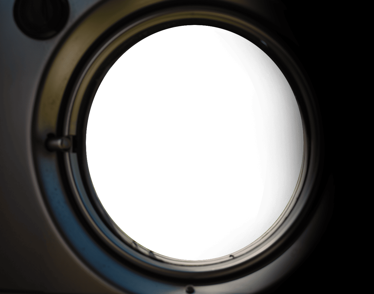 A close up of a green camera lens with Swiss Camplings.